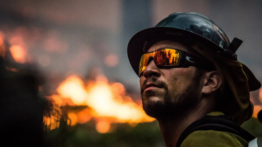 A firefighter battling a wildfire. Prevent wildfires in Truckee.