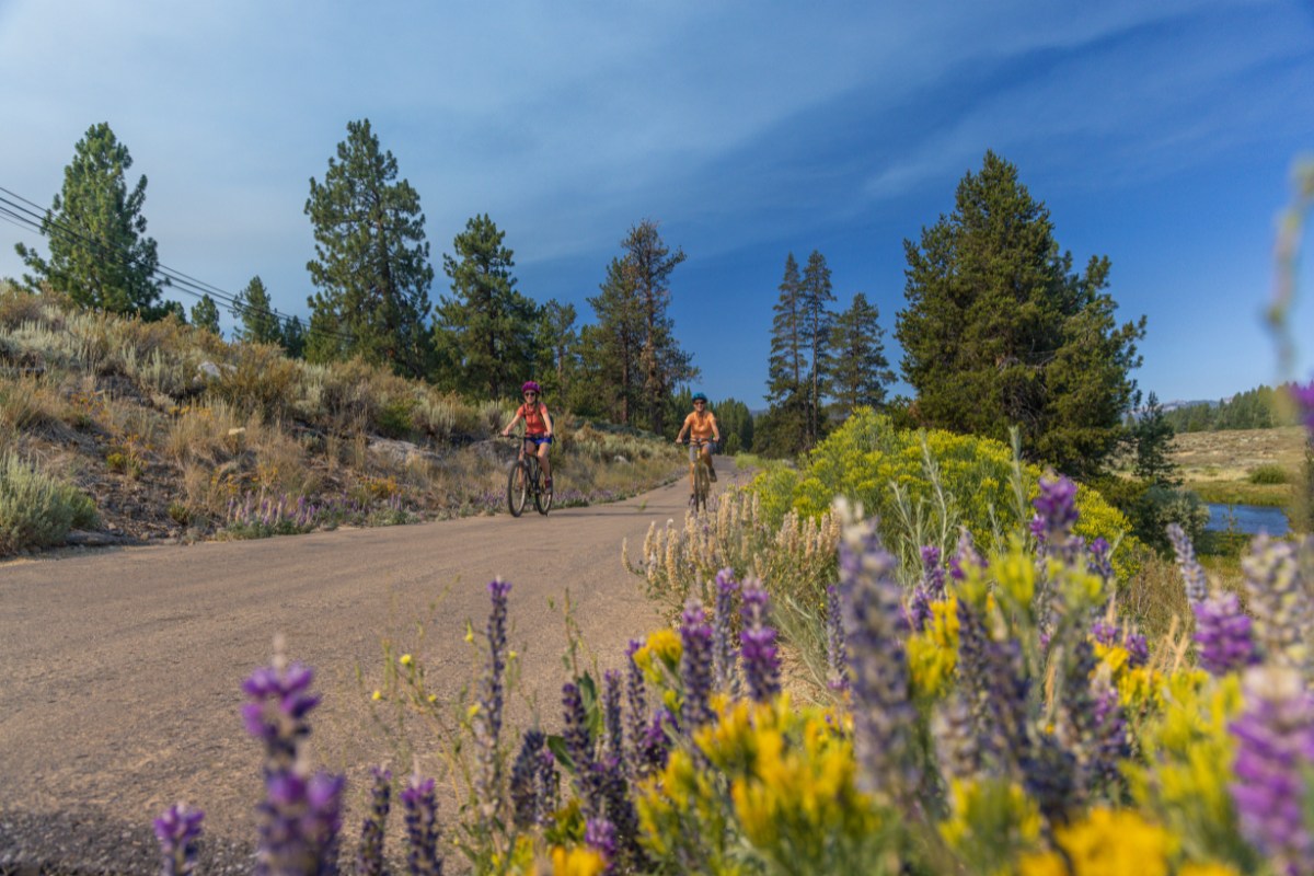 A mom and daughter riding bikes on the Legacy Trail in Truckee.