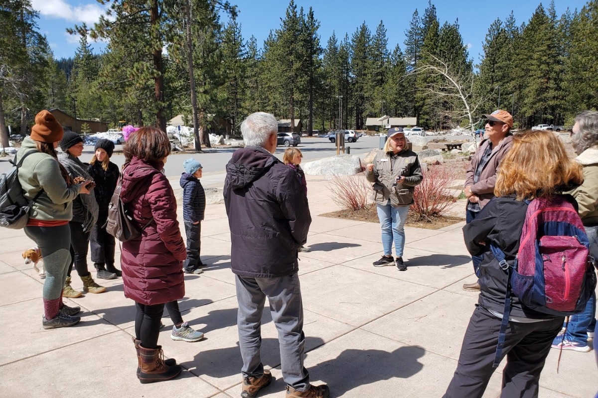 Woman talking to crowd at a Donner Memorial State Park interpretive program.