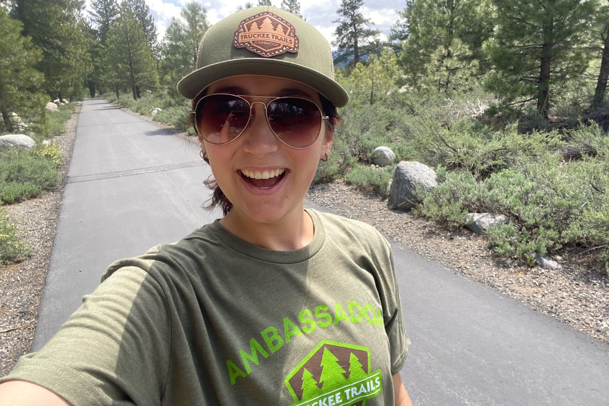 Truckee Trails Foundation ambassador standing on the Truckee River Legacy Trail.
