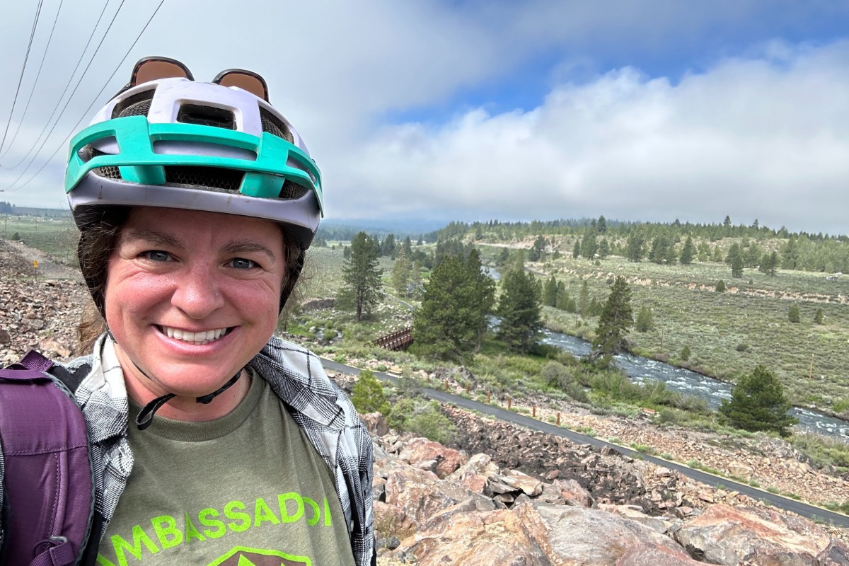 Truckee Trails Foundation ambassador on the Legacy Trail, overlooking the Truckee River.