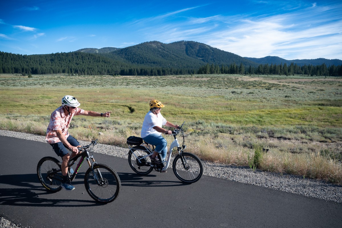 An older couple enjoys an e-bike ride on the Martis Valley Trail.