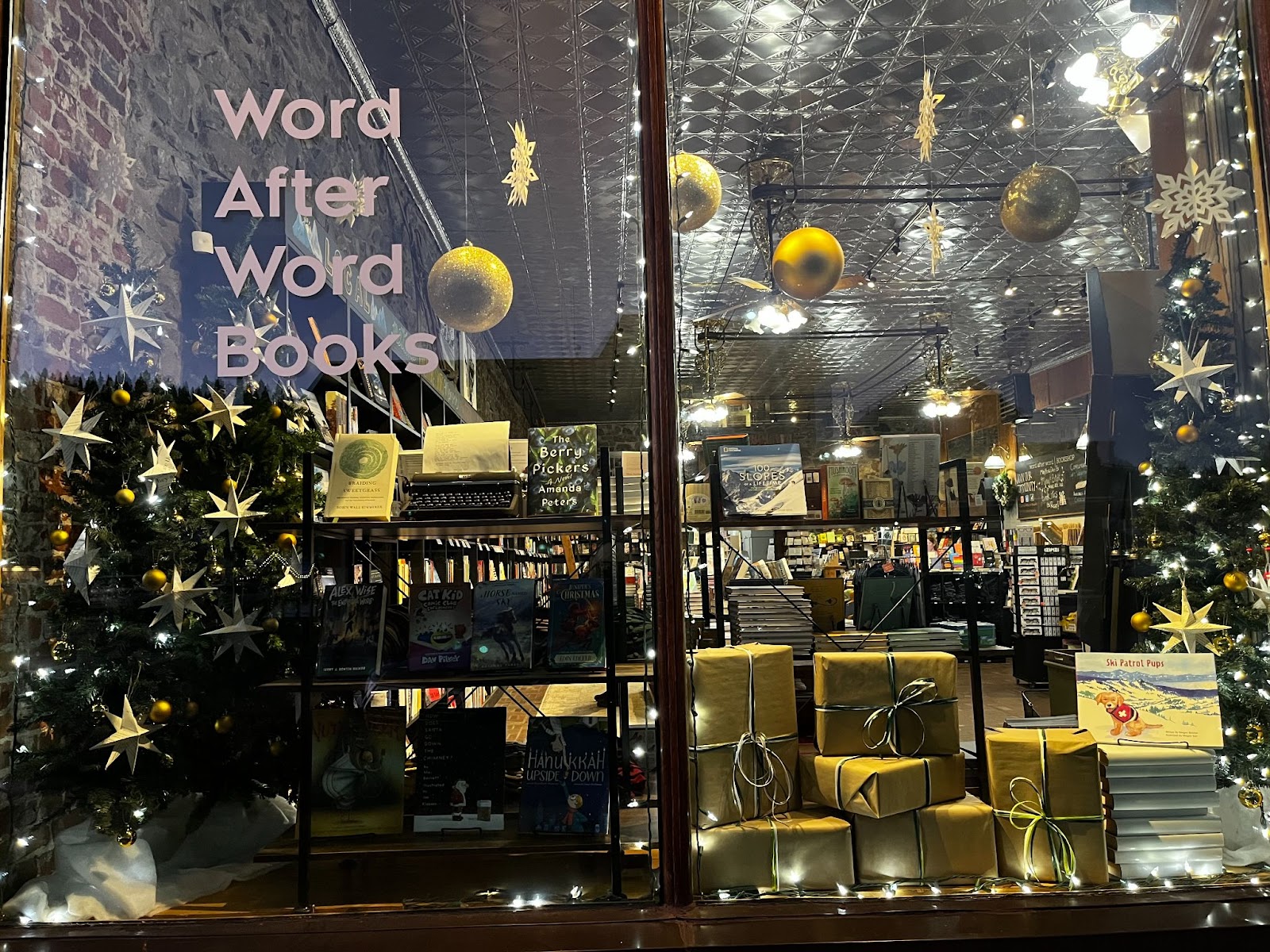 Word After Word Books decorative holiday window display in Downtown Truckee.