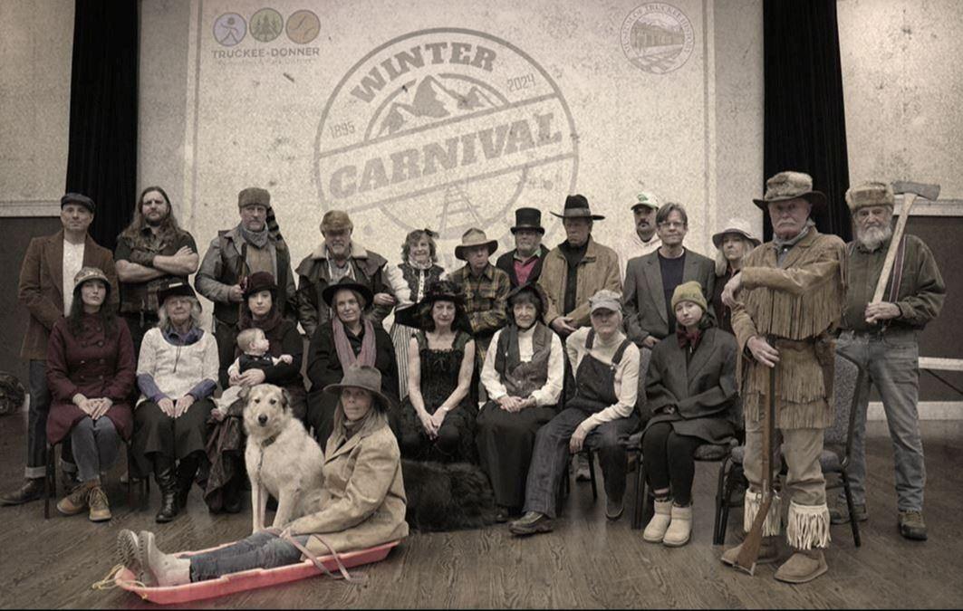 Truckee Winter Carnival group in vintage clothing with a dog in front.