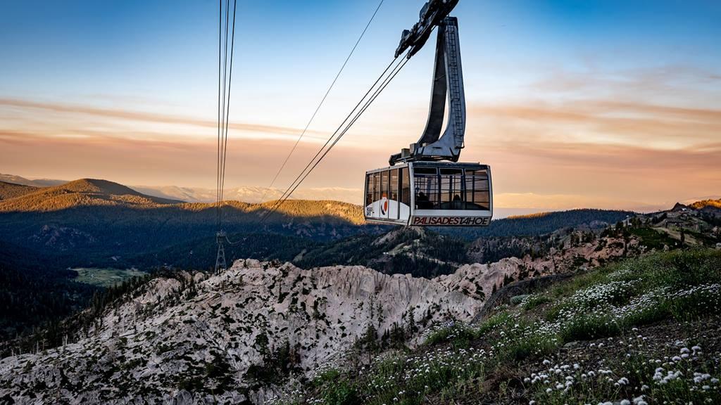 Palisades Aerial Tram over mountainous landscape at sunset.