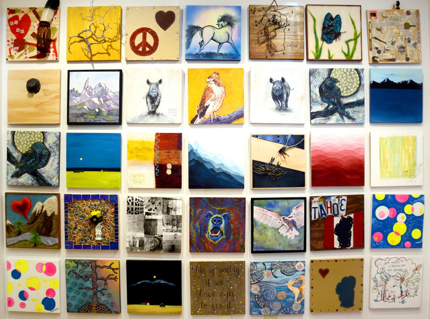 A collage of colorful, diverse artworks arranged in a grid pattern.