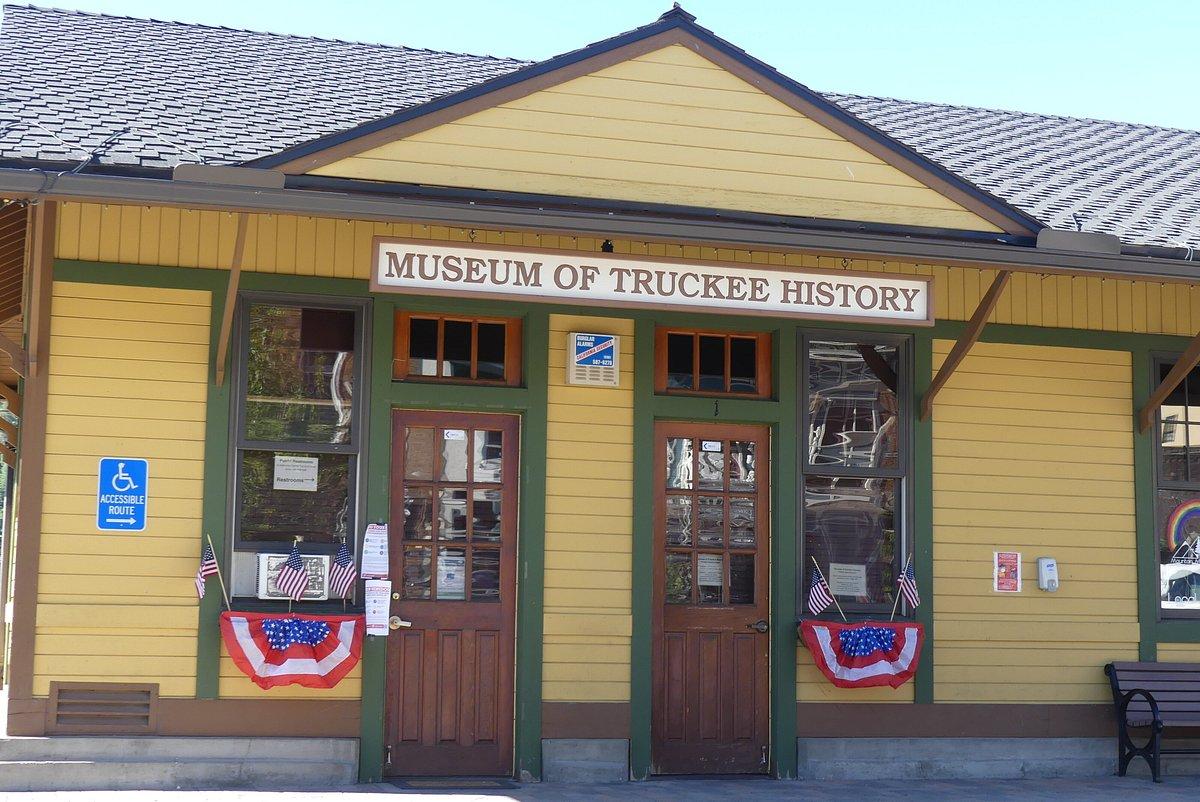 Yellow building facade with sign "Museum of Truckee History" and two wooden doors.