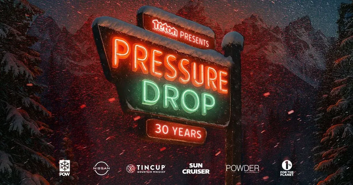 Neon sign in snowy forest, reads "Pressure Drop 30 Years."