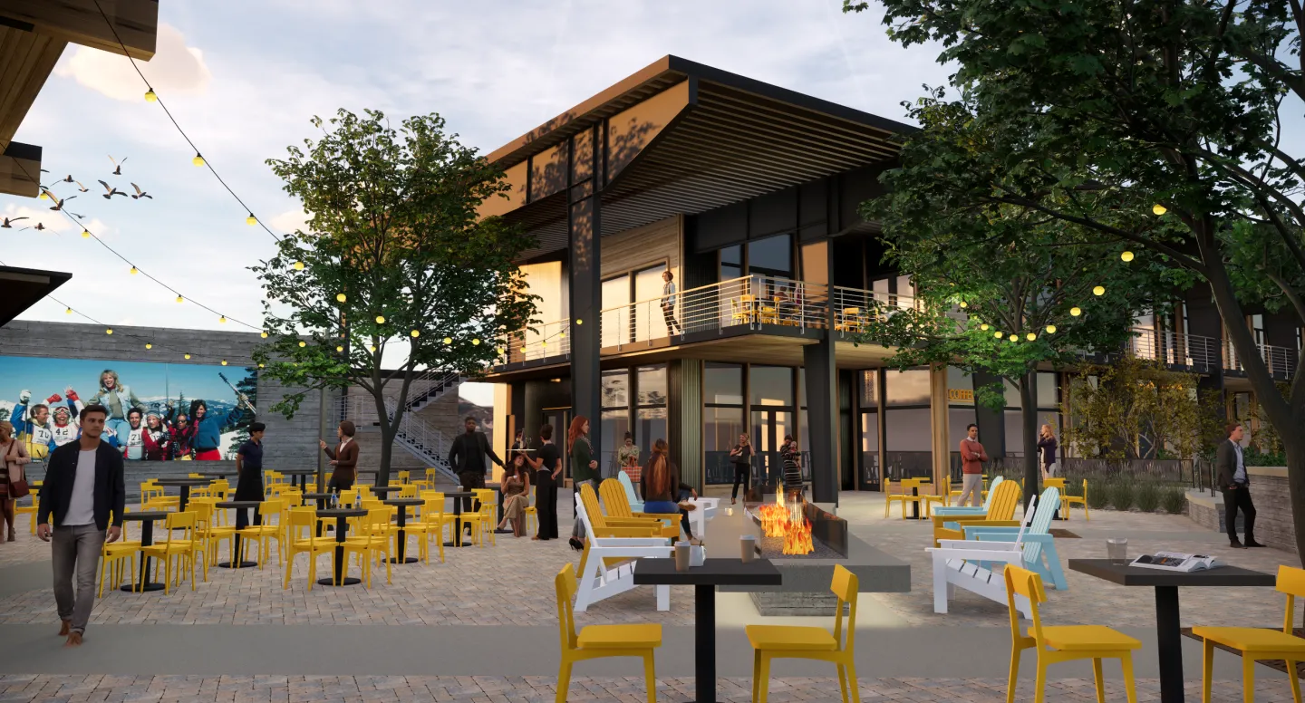 Outdoor cafe with yellow chairs, string lights, and trees at dusk.