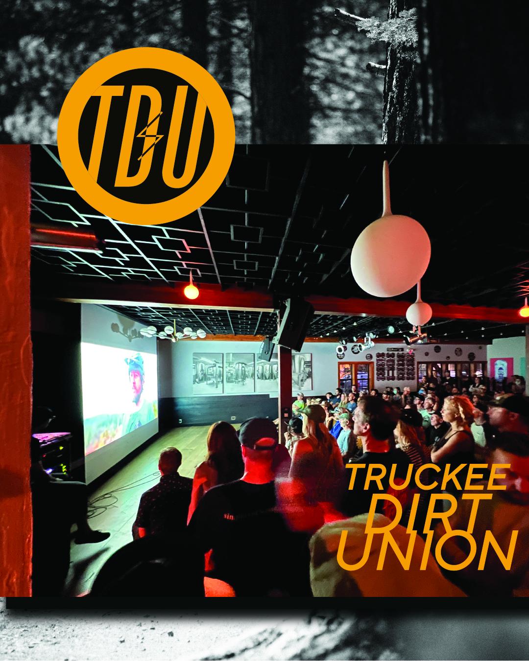 Crowd at a neon-lit truck event, with “TRUCKEE DIRT UNION” text and a yellow logo.