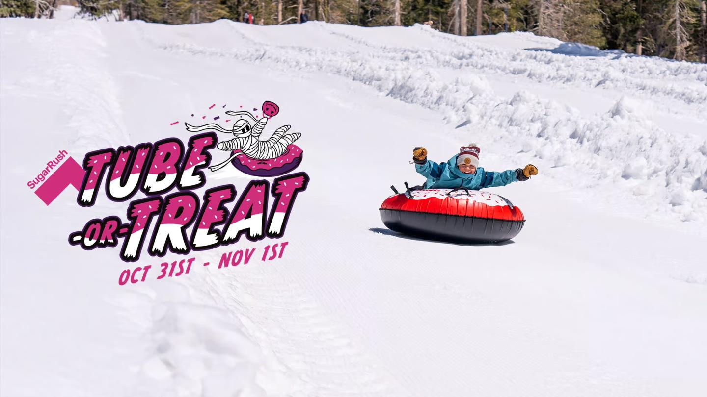 Tube Retreat logo beside a person tubing down a snowy slope.